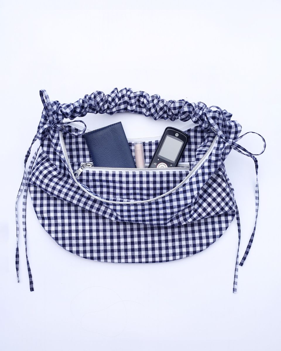 The Drawstring Crescent Bag sewing pattern features an interior zipper pocket. The pocket is 20 cm [8"] wide and can fit a phone, small wallet and lip balm.